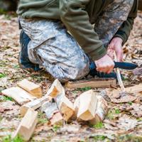 Explore various friction-based fire-starting techniques, including the hand drill and bow drill, ensuring you can light a fire in survival situations.